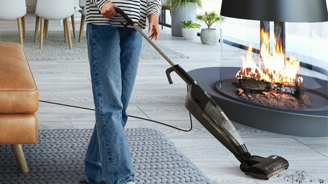 A Person using an Ionvac Spree 3 in 1 Vacuum Cleaner