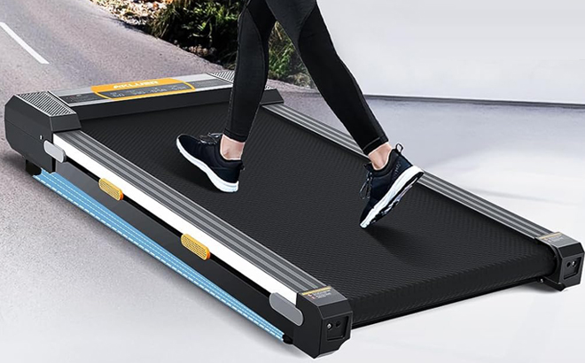 A Person walking on a Akluer Under Desk Walking Pad Treadmill 