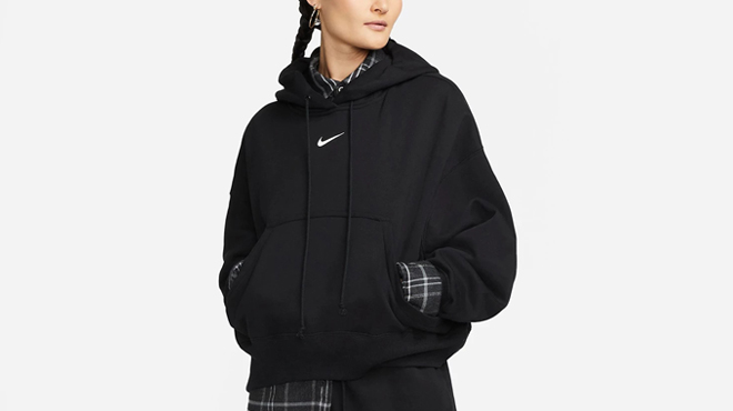 A Person wearing Nike Womens Sportswear Phoenix Fleece Over Oversized Hoodie