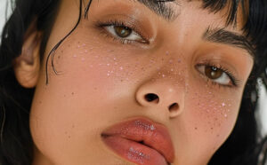 A Person with Glitter Freckles Patches on their Face