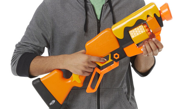 A Teenage Boy Holding the NERF Roblox Adopt Me Bees Lever Action Dart Blaster