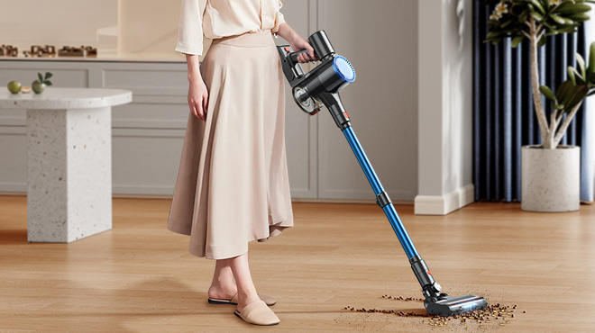 A Woman Cleaning with the WLUPEL Cordless Handheld Stick Vacuum Cleaner