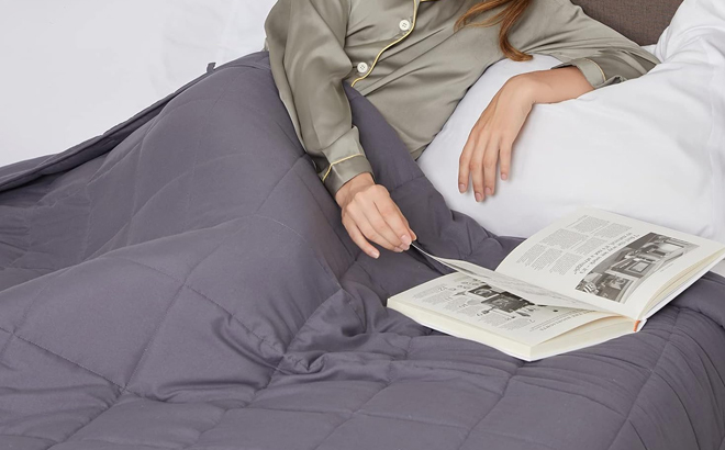 A Woman Covering with the Topcee Queen Size Weighted Blanket