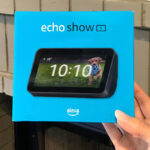 A Woman Holding Amazon Echo Show 5 Smart Display with Alexa