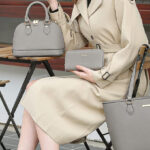 A Woman Holding Bagsure 4 Piece Handbag Set