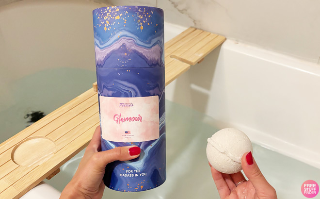 A Woman Holding Forever Fizzies Bath Bombs