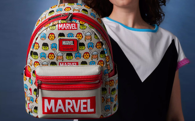 A Woman Holding Marvel The Avengers Loungefly Mini Backpack