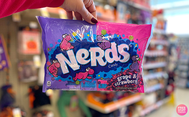 A Woman Holding Nerds Candy Bag in Strawberry & Grape