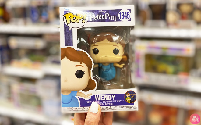 A Woman Holding a Funko Pop Disney Wendy Figure