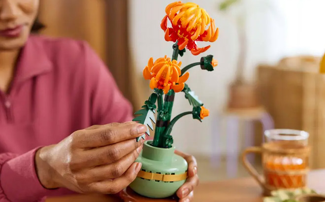 A Woman Holding a LEGO Flower