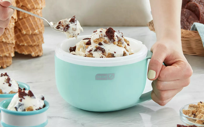 A Woman Scooping Ice Cream from Dash My Mug Ice Cream Maker