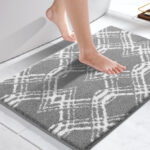 A Woman Stepping on the Yimobra Luxury Bathroom Rug