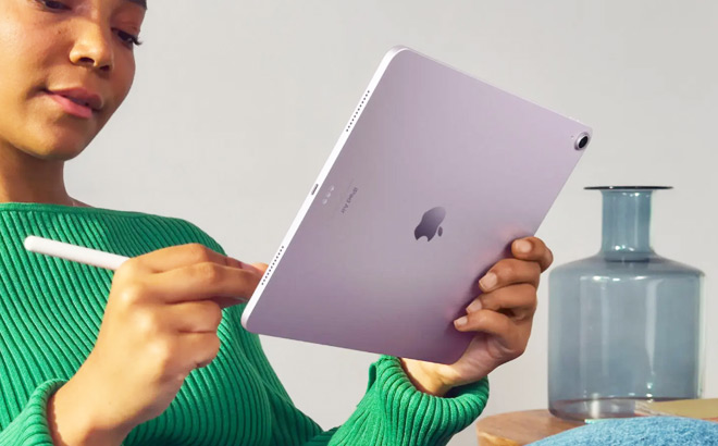 A Woman Using Apple iPad Air 13 Inch