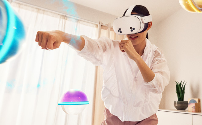 A Woman Using Meta Quest 3S VR Headset for Workouts