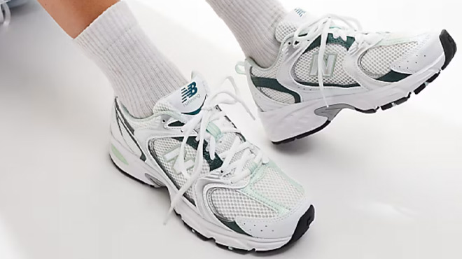 A Woman Wearing New Balance 530 Sneakers in White and Green