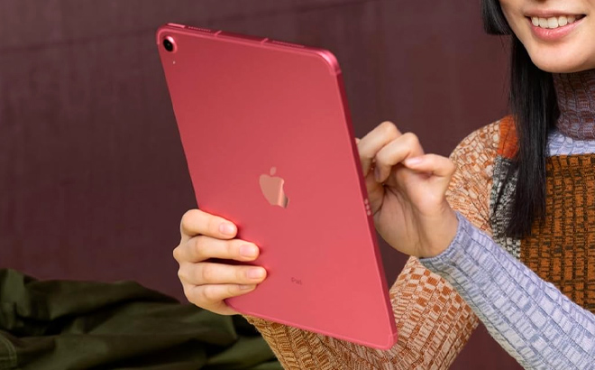 A lady holding Apple 10 9 inch iPad 10th Gen