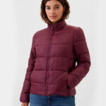 A lady wearing GAP Factory Womens ColdControl Puffer Jacket in burgundy pinot noir color 1