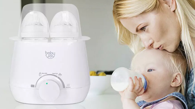 A mother feeding her baby using a feeding bottle sterilized from Costway 3 in 1 Baby Bottle Warmer