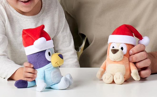 A parent and a child playing with Bluey Amazon Exclusive Plush Soft Toy Bundle