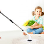 A person cleaning the floor using Uranzl Electric Spin Scrubber