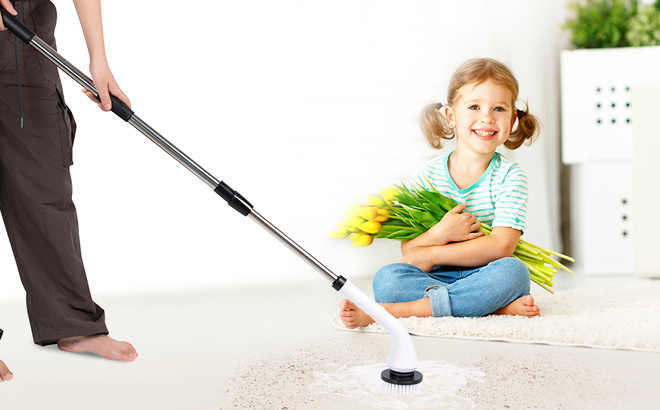 A person cleaning the floor using Uranzl Electric Spin Scrubber