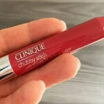 A person holding a Clinique Chubby Stick Lip Color Balm