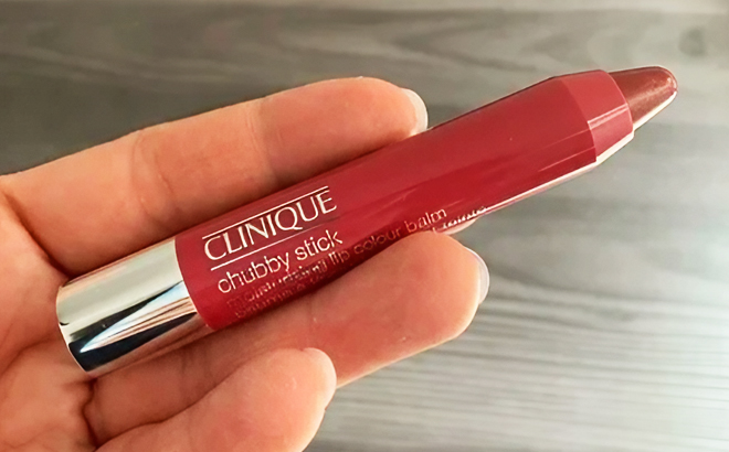 A person holding a Clinique Chubby Stick Lip Color Balm