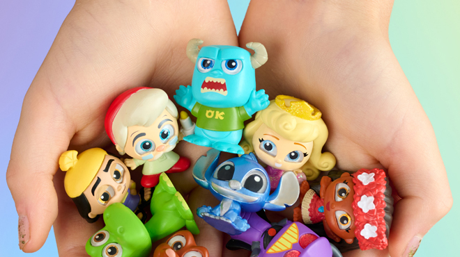 A person holding a Disney Doorables Multi Peek Series 10 Figures