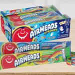 Airheads Xtremes Rainbow Berry and Bluest Raspberry Flavor Candy 18 Count Pack on a Table