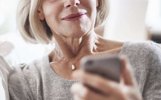 An Older Woman Looking at Her Phone