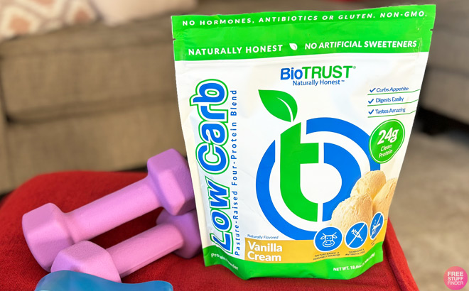 BioTrust Low Carb Protein Bag Next to a Hand Weights Set