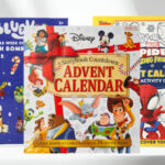 Disney Storybook Countdown Advent Calendar Bluey Christmas Countdown Bath Bomb Calendar and Marvel Coloring Activity Advent Calendar on a Table