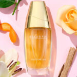 Estee Lauder Beautiful Eau de Parfum Spray Alonside Flowers