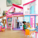 Girl Playing with Barbie Malibu House