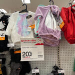 Halloweeen Costumes on Shelves and a Discount Sign at Target