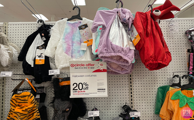 Halloweeen Costumes on Shelves and a Discount Sign at Target