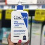 Hand holding CeraVe Moisturizing Face and Body Lotion 2