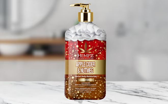 Hempz Apple Cider Nutmeg Herbal Body Lotion on a Marble Counter