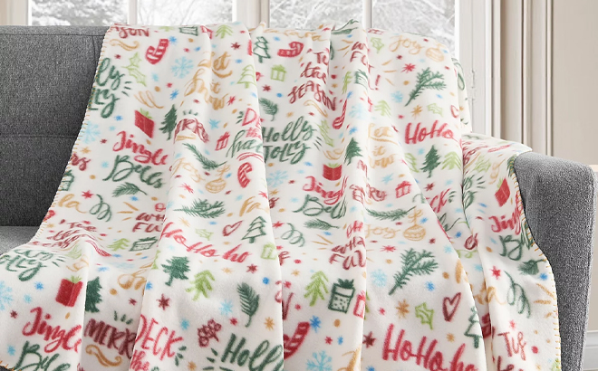 Holiday Printed Birch Trail Fleece Throw on a Sofa