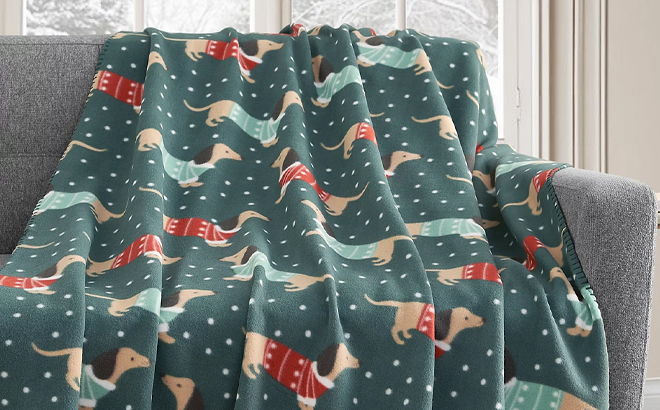 Holiday Printed Dachsund Fleece Throw on a Sofa