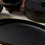 Infuse Latin Cast Iron 8 Piece Fajita Set on a Table