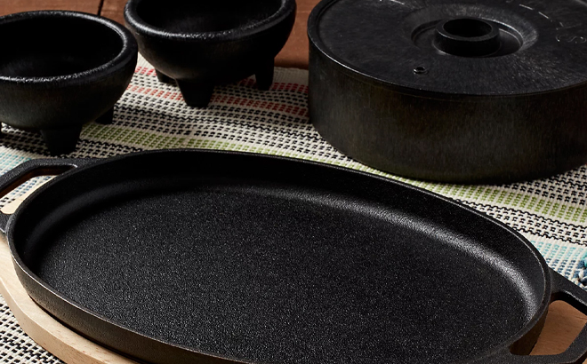 Infuse Latin Cast Iron 8 Piece Fajita Set on a Table