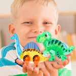 Kid Holding a Dinosaur Toys