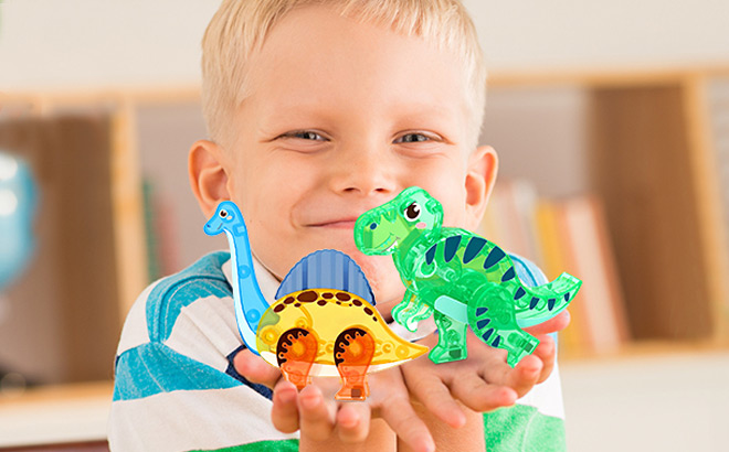 Kid Holding a Dinosaur Toys