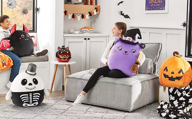 Kids Playing with Halloween Secret Pocket Squishy Plushes