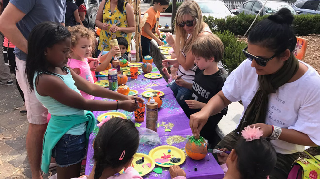 Kids and Parents Involved in Activities at Mr. Jack O' Lanterns Pumpkin Patch