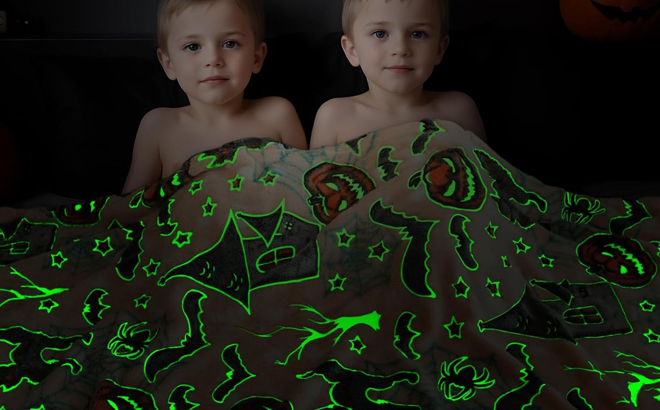 Kids under a Halloween Pumpkin Kids Glow in the Dark Blanket