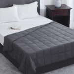 L'Agraty Weighted Blanket in Dark Gray on a Bed