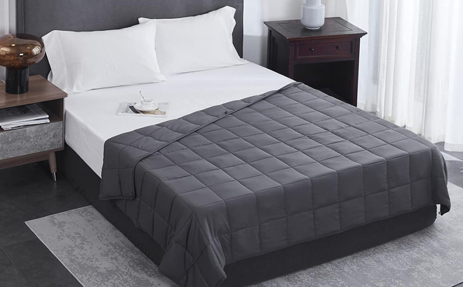 L'Agraty Weighted Blanket in Dark Gray on a Bed