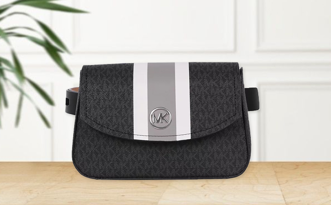 Michael Kors Logo Belt Bag with Stripe on a Table